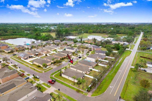 bird's eye view featuring a water view and a residential view