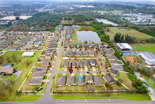 aerial view with a water view and a residential view