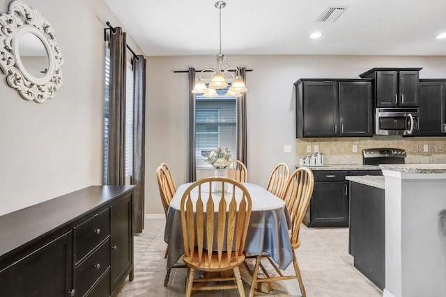 dining area featuring light tile patterned floors, baseboards, visible vents, a notable chandelier, and recessed lighting