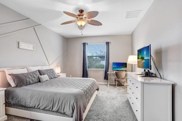 bedroom with a ceiling fan, visible vents, light carpet, and baseboards