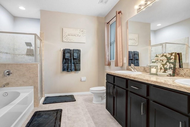 bathroom featuring a stall shower, a garden tub, a sink, and double vanity