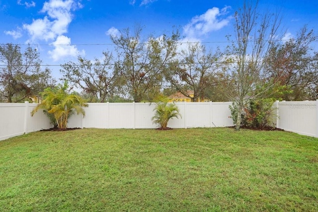 view of yard with a fenced backyard