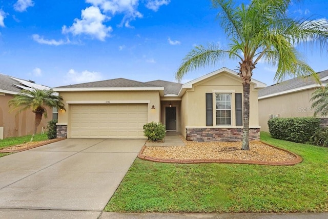 single story home featuring a garage, driveway, stone siding, stucco siding, and a front yard