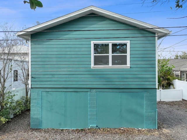 view of side of property with fence