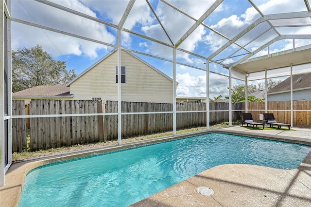 view of pool featuring a lanai, a patio area, a fenced backyard, and a fenced in pool