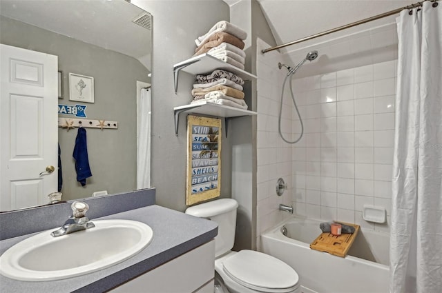 bathroom with toilet, visible vents, shower / bath combination with curtain, and vanity