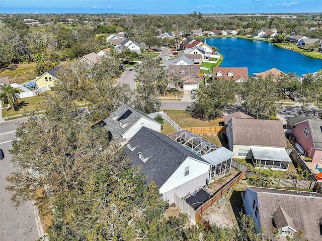 drone / aerial view with a residential view and a water view