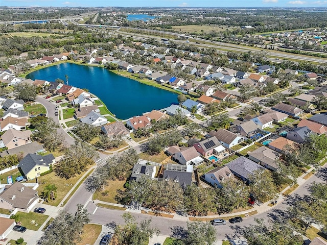 bird's eye view featuring a water view and a residential view