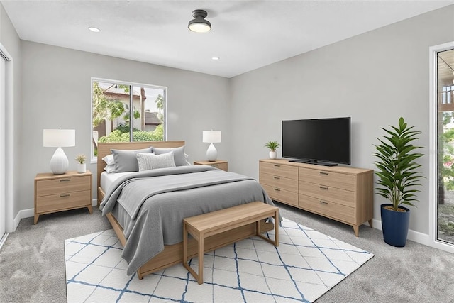 bedroom with light carpet, recessed lighting, and baseboards