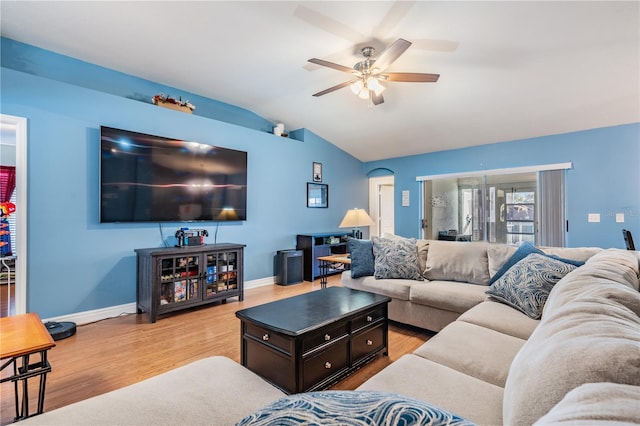 living area featuring light wood-type flooring, baseboards, ceiling fan, and lofted ceiling