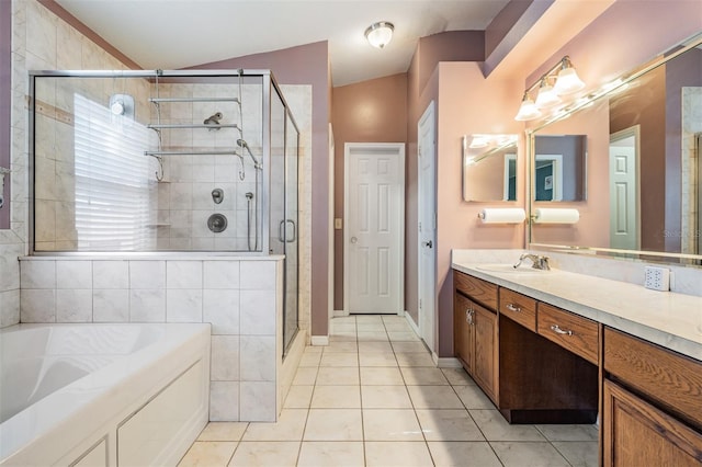 full bathroom with tile patterned flooring, vanity, a bath, a shower stall, and vaulted ceiling
