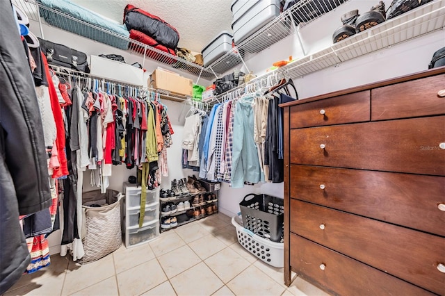 walk in closet featuring tile patterned flooring