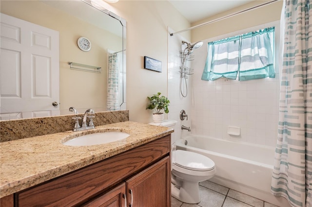 bathroom featuring tile patterned floors, shower / bath combo with shower curtain, vanity, and toilet