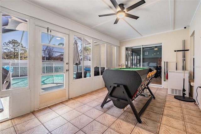 sunroom with pool table, french doors, and a wealth of natural light