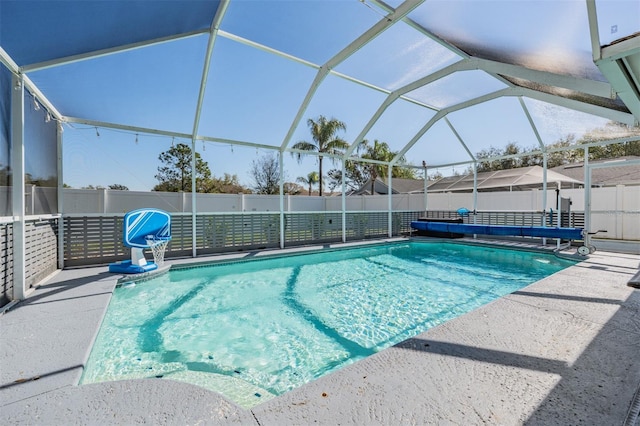 view of pool featuring a fenced in pool, glass enclosure, a patio area, and fence