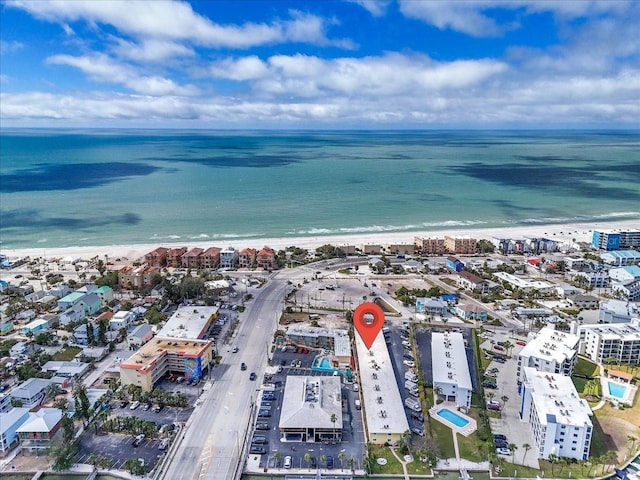 aerial view with a water view, a view of the beach, and a city view