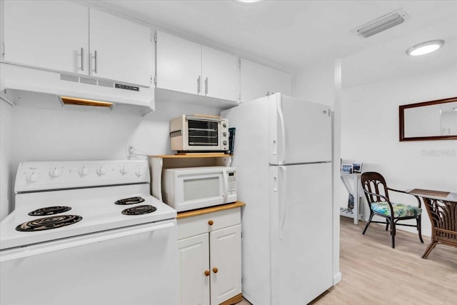 kitchen featuring white appliances, visible vents, light wood-style flooring, under cabinet range hood, and white cabinetry