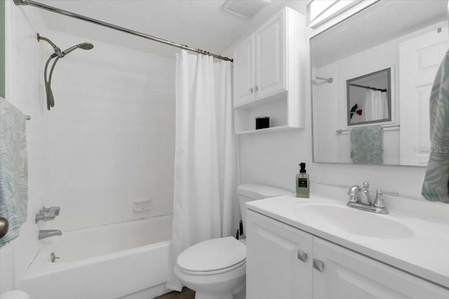 full bathroom featuring toilet, vanity, visible vents, and shower / tub combo with curtain