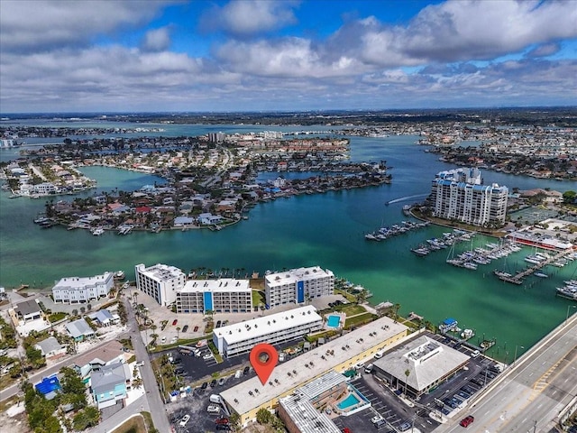 birds eye view of property with a view of city and a water view