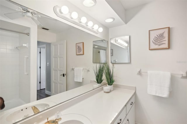 bathroom with shower / tub combo with curtain, visible vents, a ceiling fan, and vanity