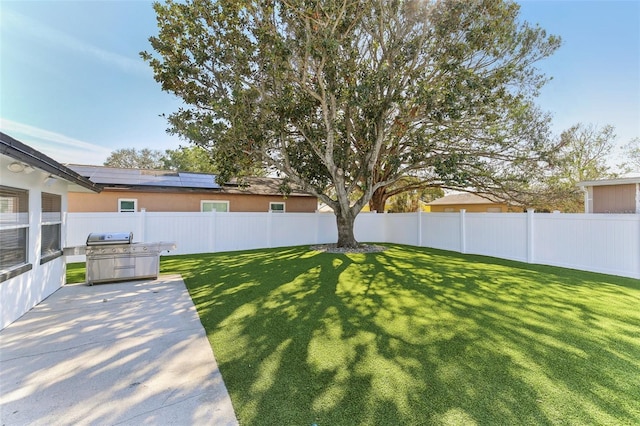 view of yard with a fenced backyard