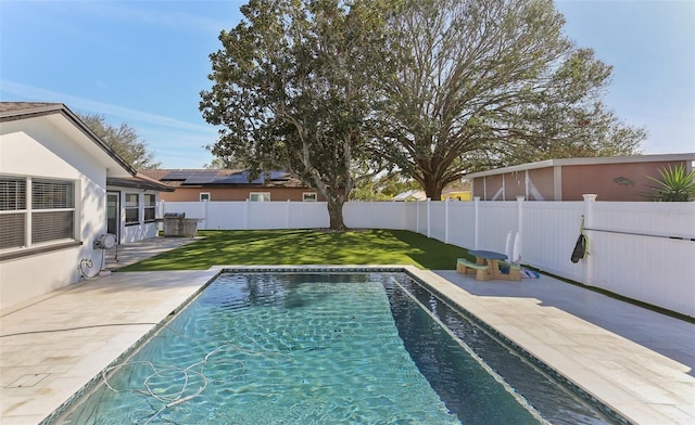 view of pool featuring a yard, a patio, a fenced backyard, and a fenced in pool