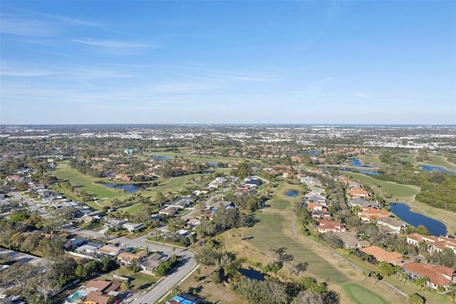 drone / aerial view with a water view and a residential view