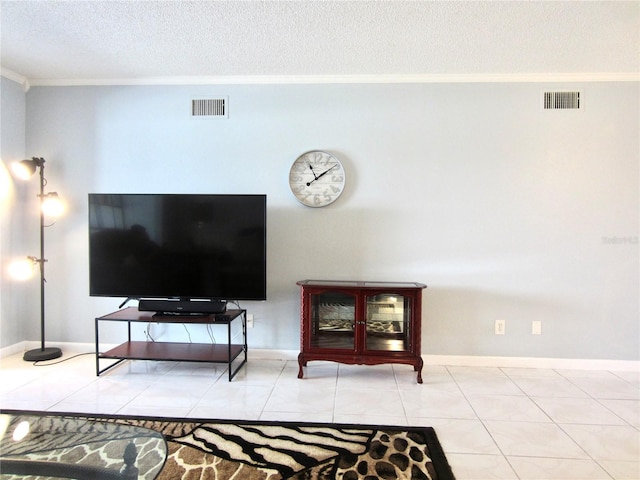 tiled living room with baseboards, a textured ceiling, visible vents, and crown molding