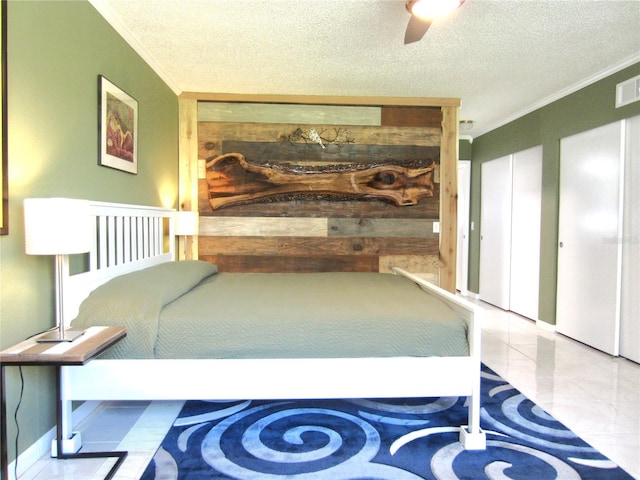 bedroom with a textured ceiling, ornamental molding, a ceiling fan, and wooden walls