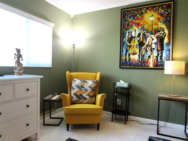 living area featuring baseboards