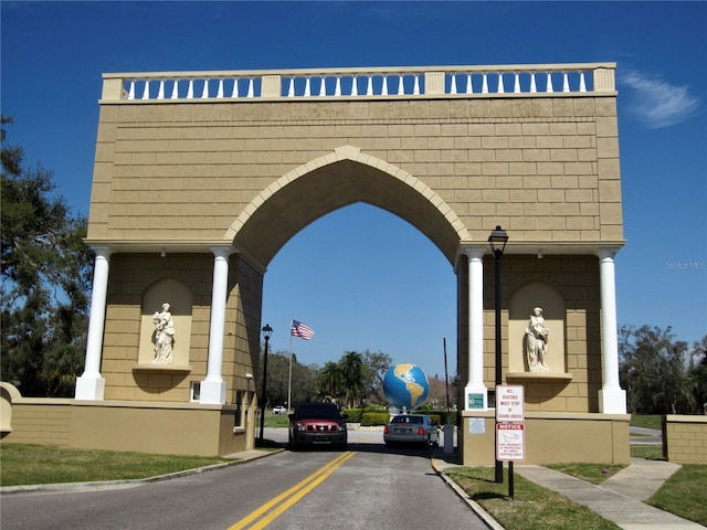 view of street with sidewalks, street lighting, and curbs