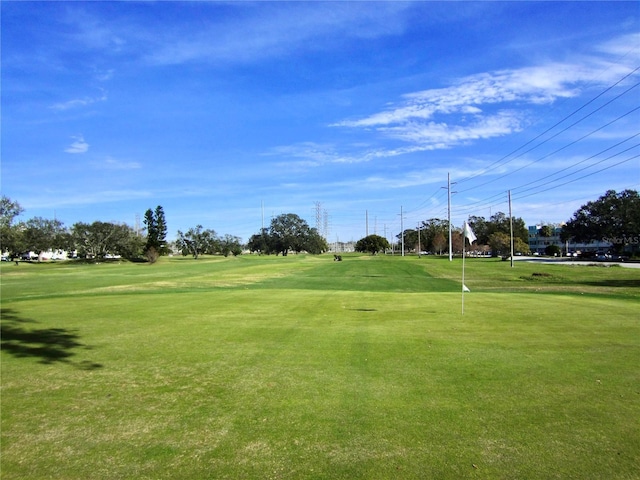 view of property's community with a lawn