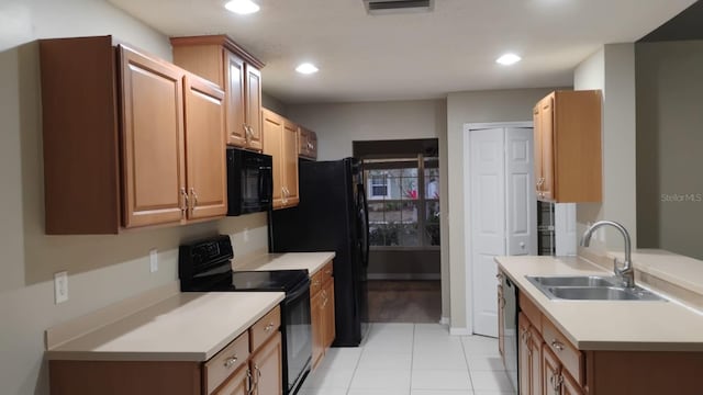 kitchen with recessed lighting, light countertops, visible vents, a sink, and black appliances