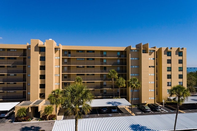 view of property featuring uncovered parking