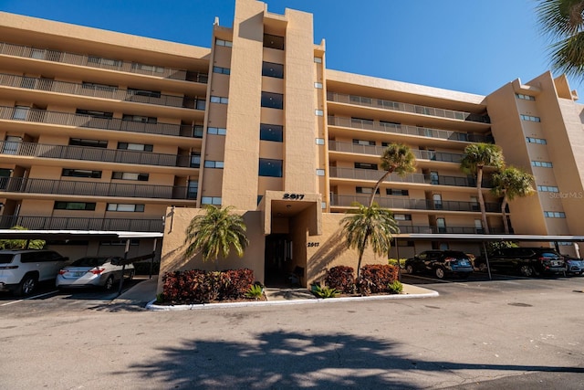 view of property featuring covered parking