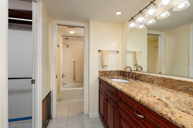 bathroom featuring shower / tub combination, tile patterned flooring, vanity, and baseboards