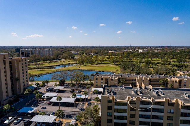 bird's eye view with view of golf course and a water view