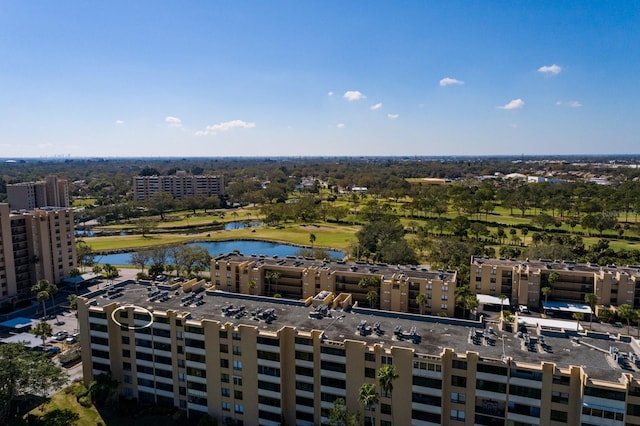 birds eye view of property with a water view and a city view