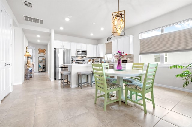 dining area featuring baseboards, light tile patterned flooring, visible vents, and recessed lighting