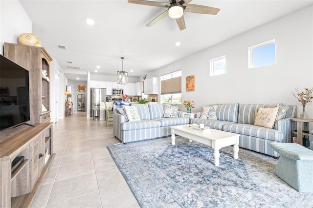 living area featuring light tile patterned floors, ceiling fan, visible vents, and recessed lighting