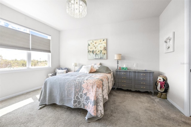 carpeted bedroom with baseboards