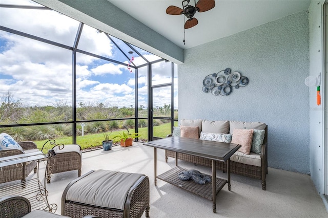 sunroom with a ceiling fan