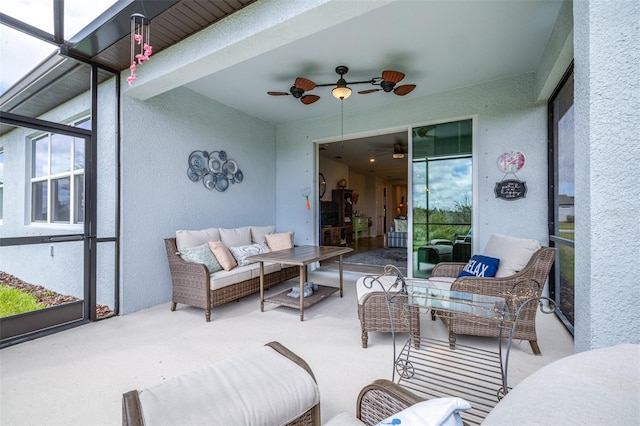 sunroom with a ceiling fan