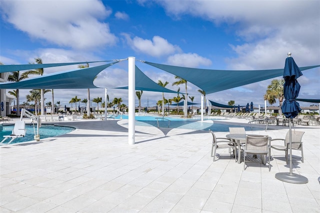 pool with a patio area