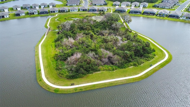 bird's eye view featuring a residential view and a water view