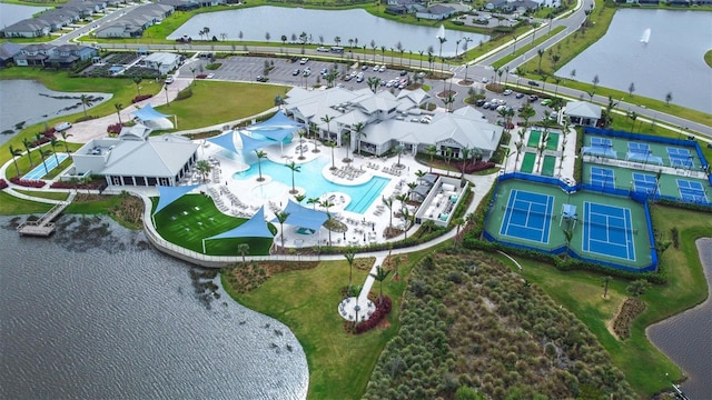 birds eye view of property featuring a water view and a residential view