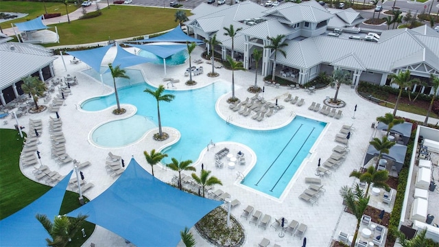 community pool with a patio area