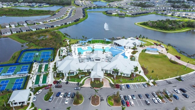 birds eye view of property featuring a water view and a residential view