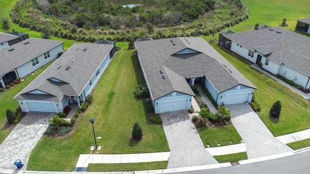 birds eye view of property with a residential view