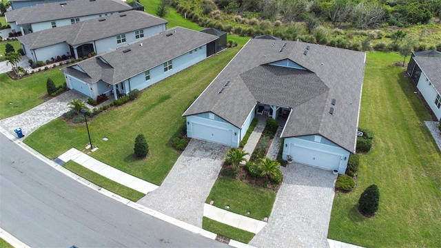 birds eye view of property with a residential view